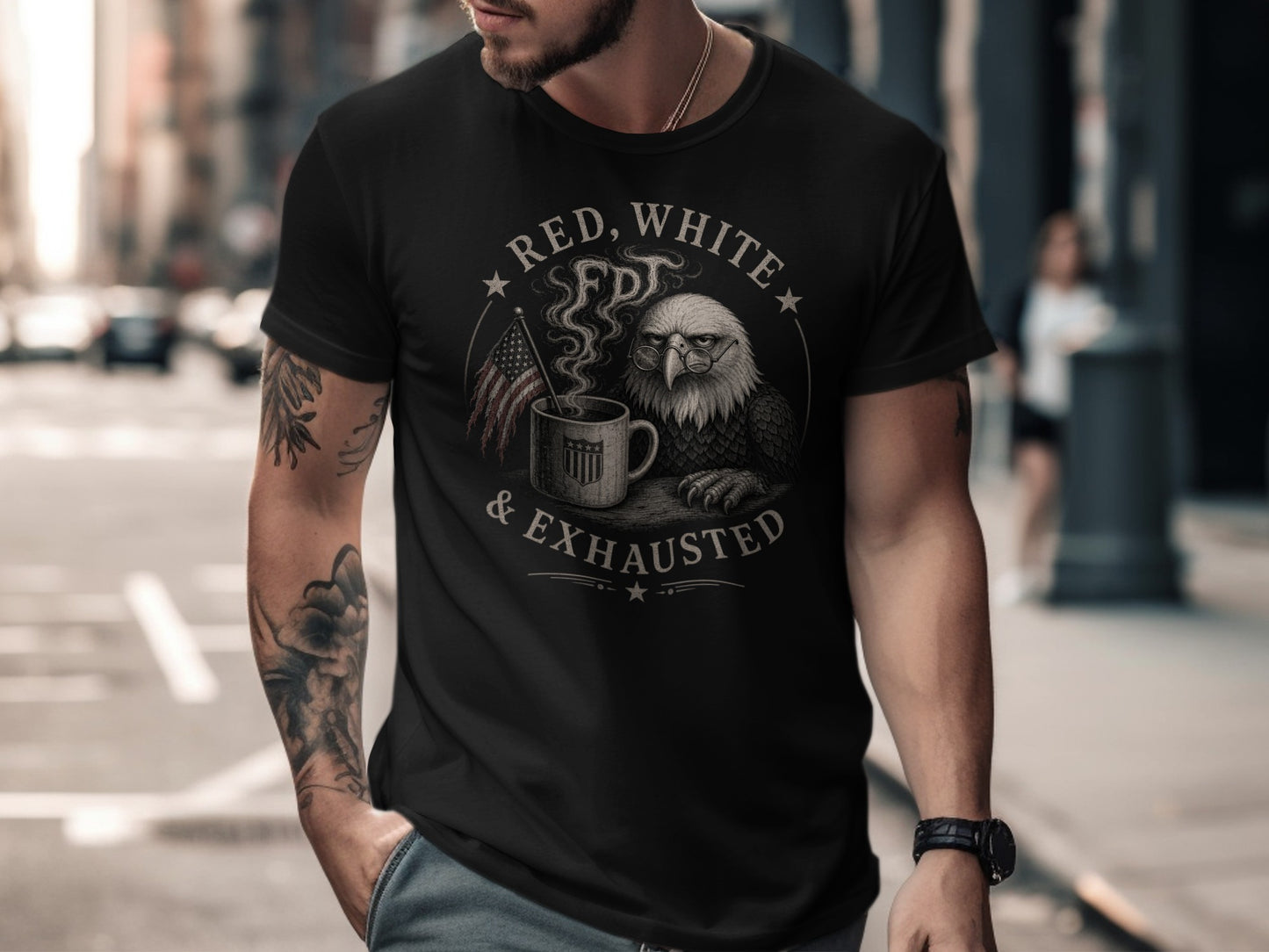 Black t-shirt with patriotic eagle, coffee mug, and text "RED, WHITE & EXHAUSTED".