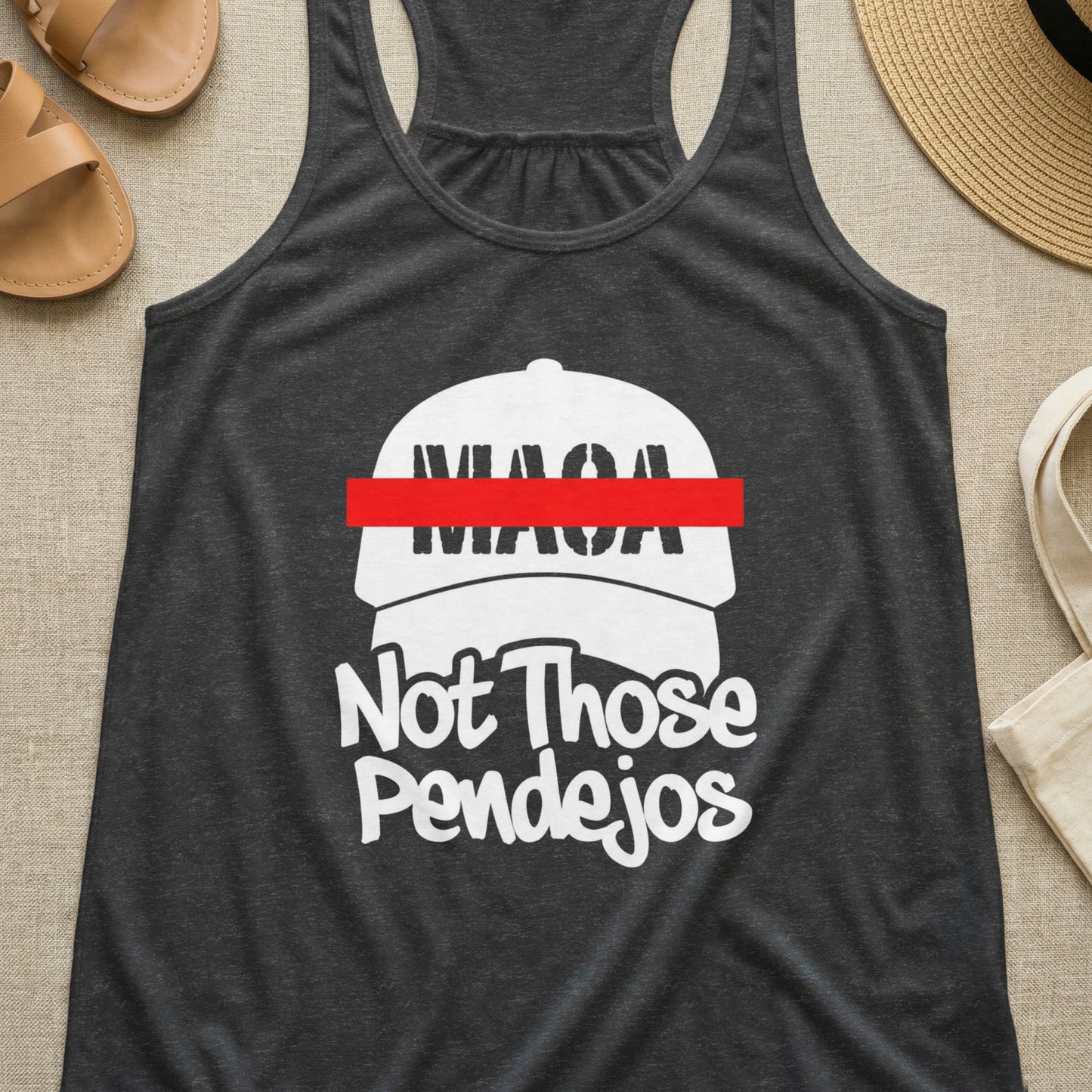 Dark gray tank top with "MAGA Not Those Pendejos" and a red bar over "MAGA".