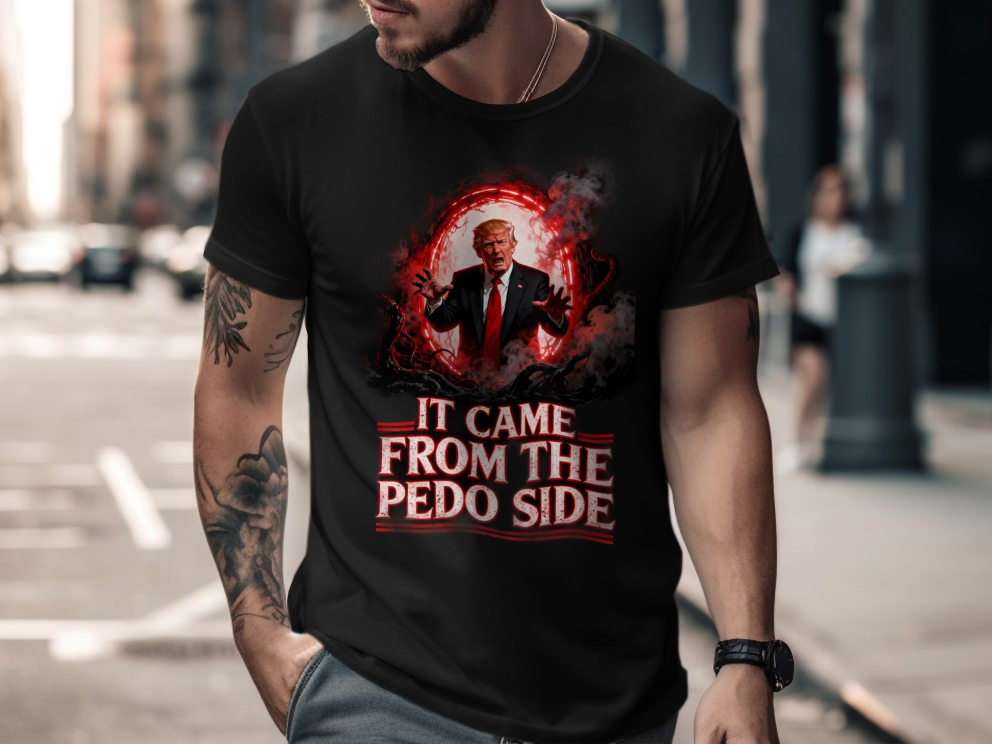 Black t-shirt with "IT CAME FROM THE PEDO SIDE" text and fiery Trump graphic.