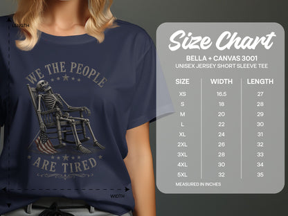 T-shirt with skeleton on rocking chair, "WE THE PEOPLE ARE TIRED" text, and size chart.