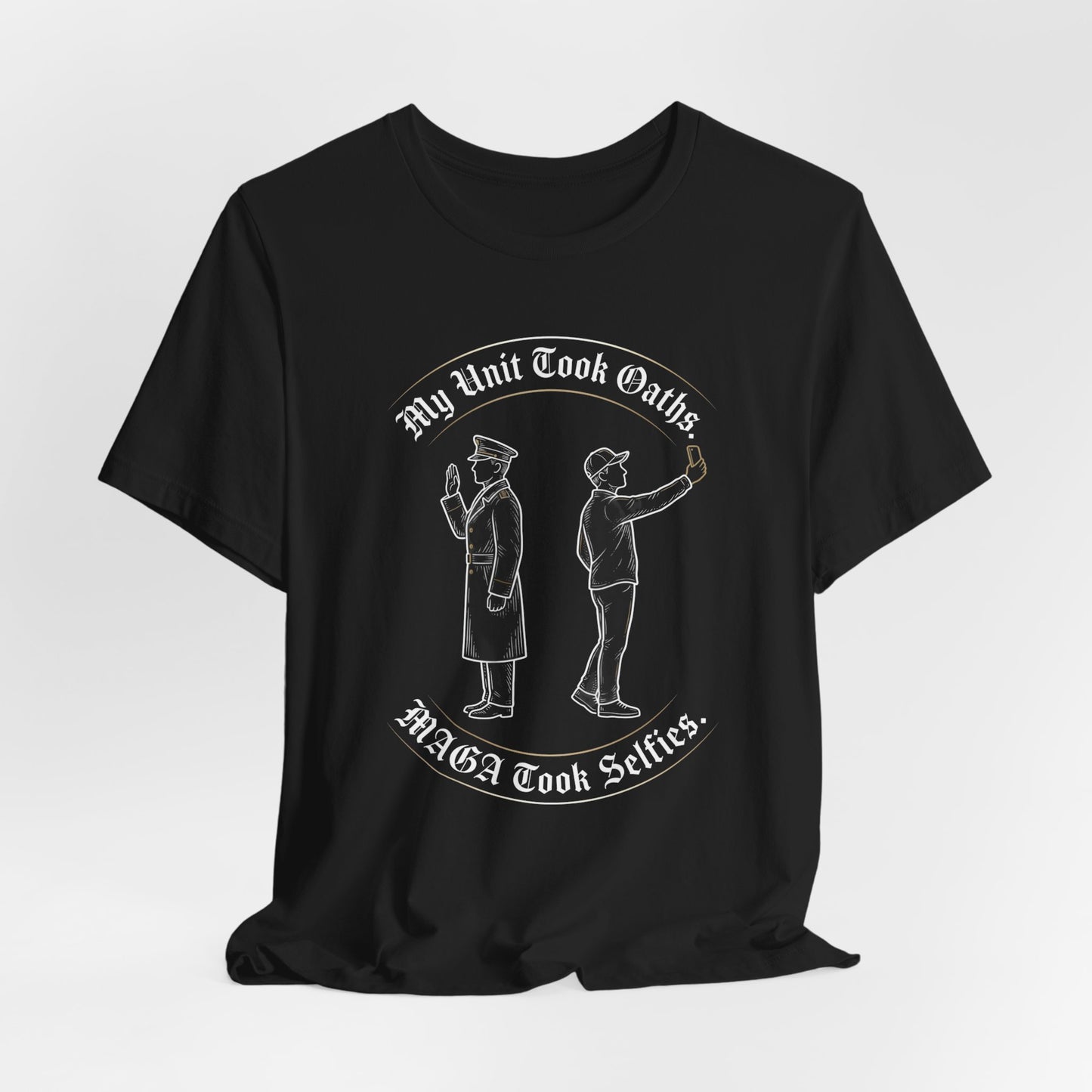 T-shirt with white text "My Unit Took Oaths. MAGA Took Selfies." and line drawing of two men.