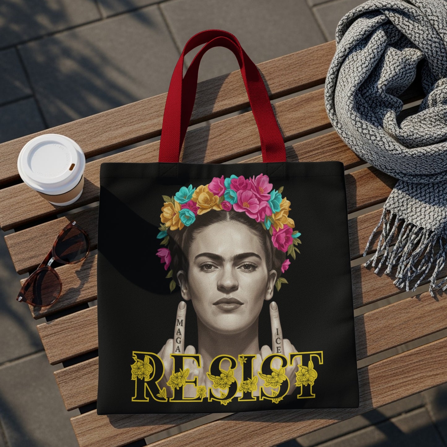 Frida Kahlo graphic on black tote bag with "MAGA RESIST" text.