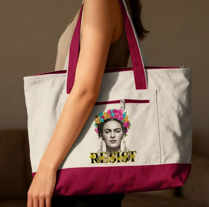 Tote bag with Frida Kahlo portrait and "RESIST" text.