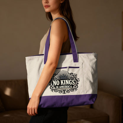 White canvas tote bag with purple trim and "No Kings In America" text.