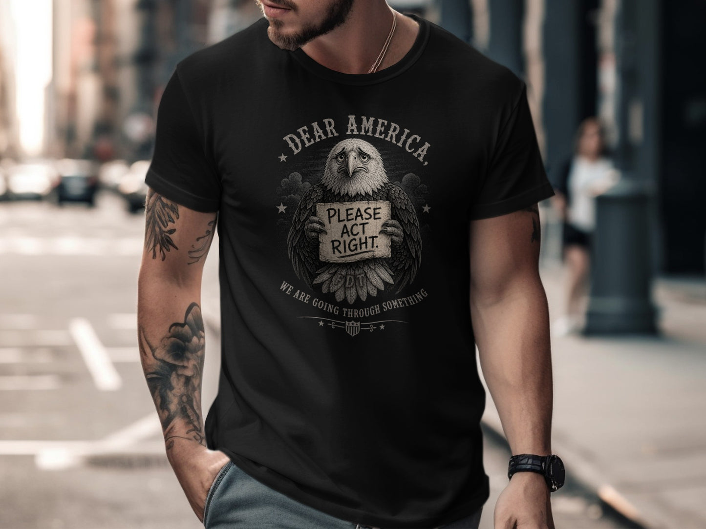 Black t-shirt with "Dear America, Please Act Right" eagle graphic.