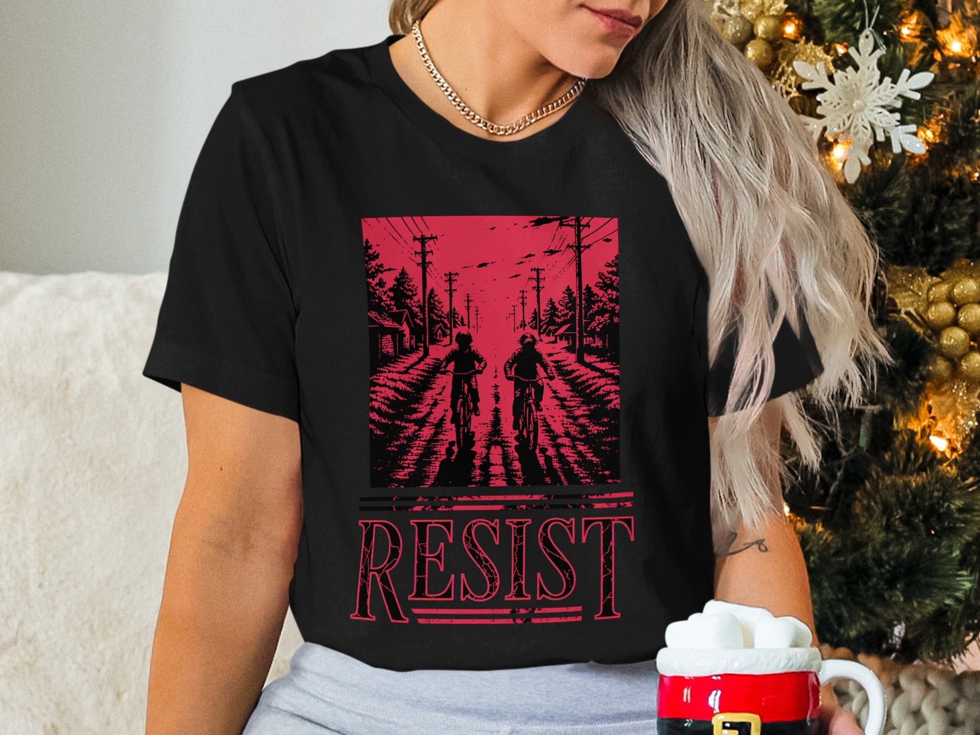Black t-shirt with "RESIST" and distressed Stranger Things-inspired scene.