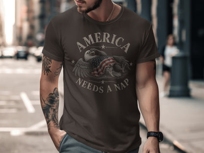 Dark t-shirt with eagle and American flag graphic, reads "America Needs a Nap".