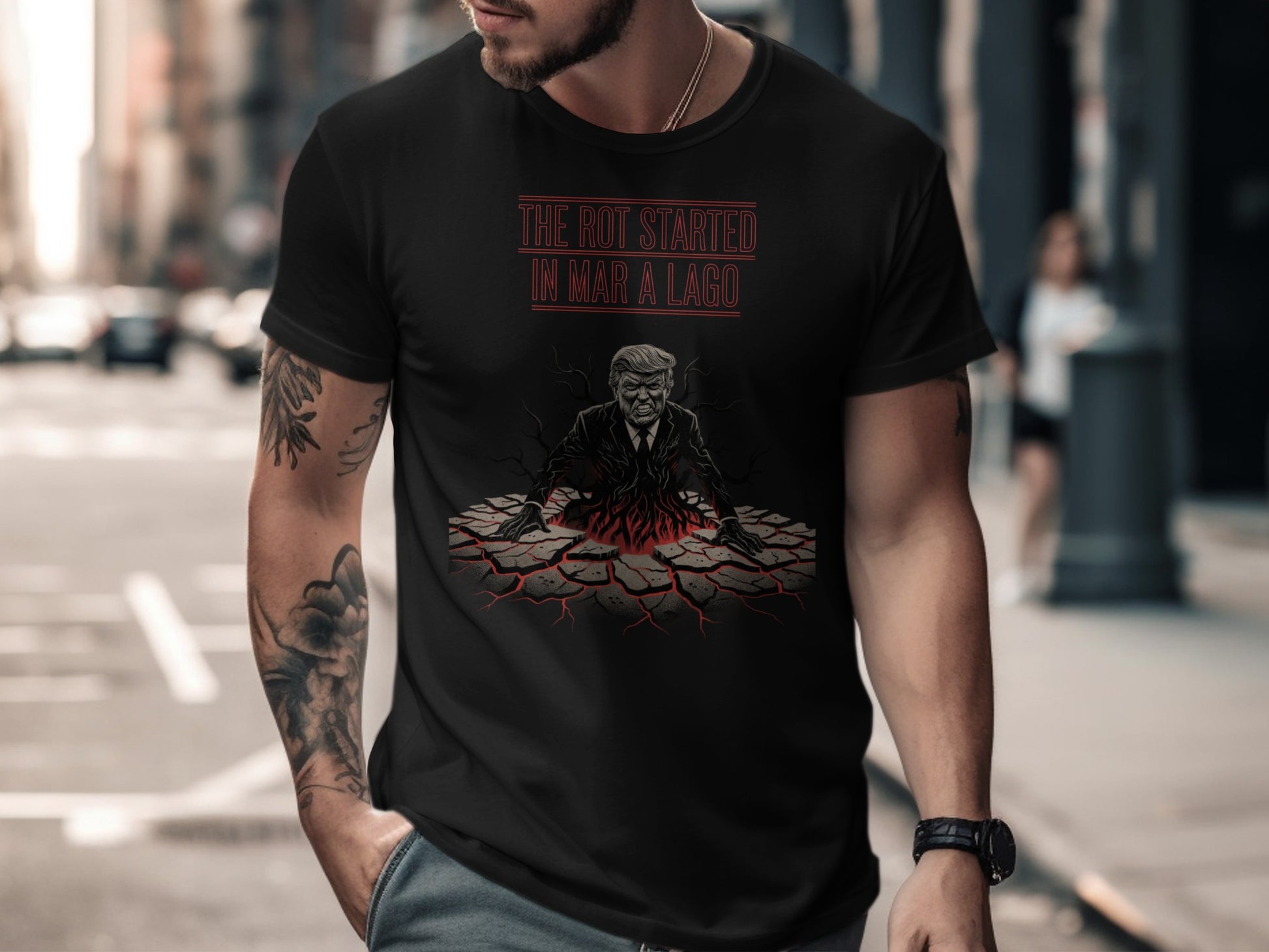 Black t-shirt with graphic of Trump rising from cracked ground with text "THE ROT STARTED IN MAR-A-LAGO".