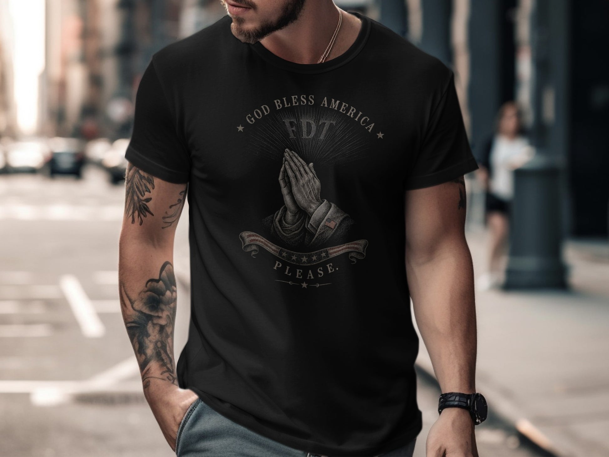 Black t-shirt with praying hands and "God Bless America" text.
