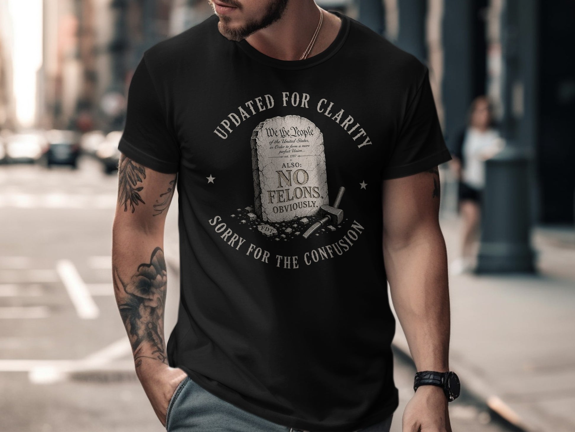 Black t-shirt with "UPDATED FOR CLARITY" and "NO FELONS, OBVIOUSLY" text.