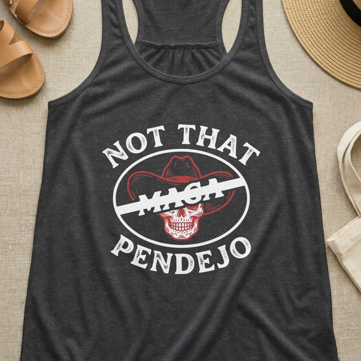 Dark gray tank top with "Not That MAGA Pendejo" text and a crossed-out cowboy hat.