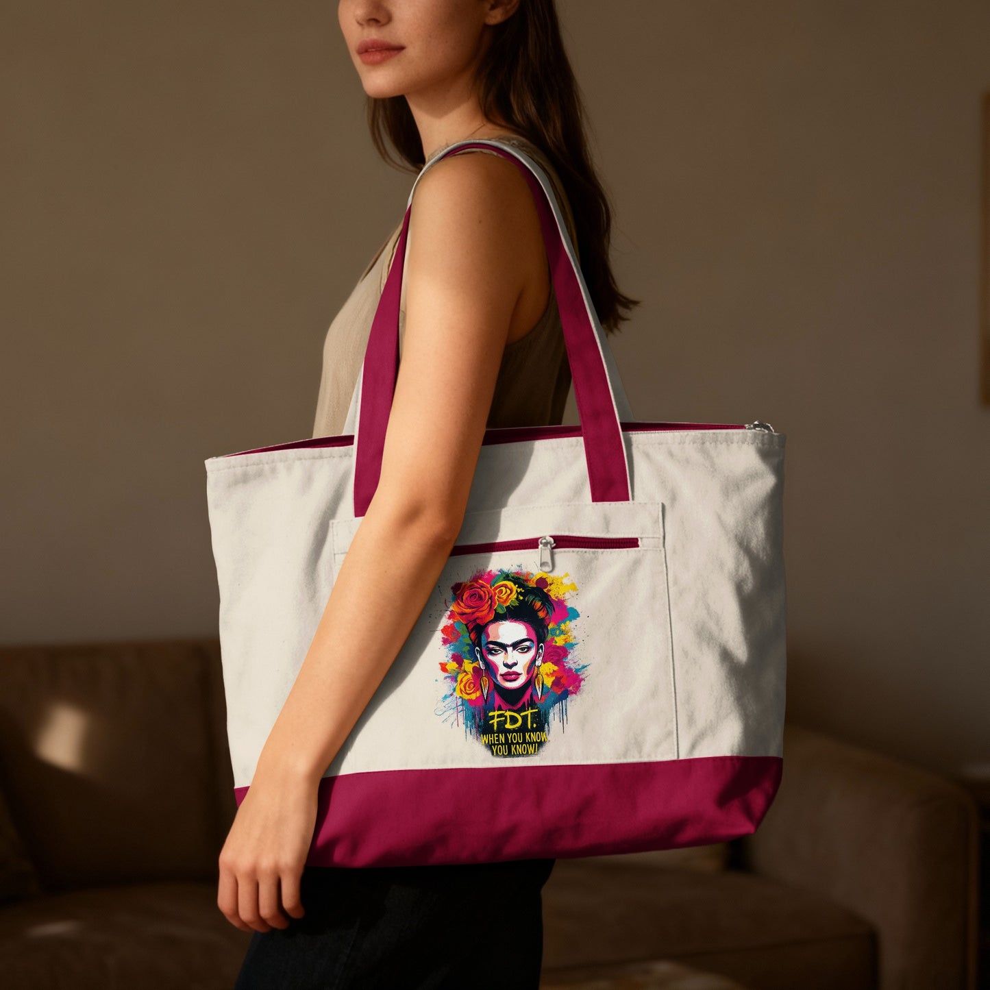 Cream tote bag with Frida Kahlo graphic and maroon trim.