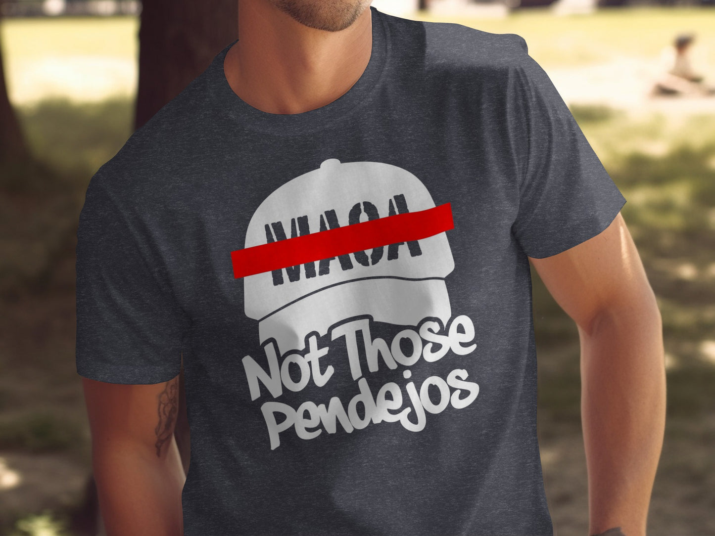 Dark t-shirt with "MAGA Not Those Pendejos" and a red-lined cap graphic.