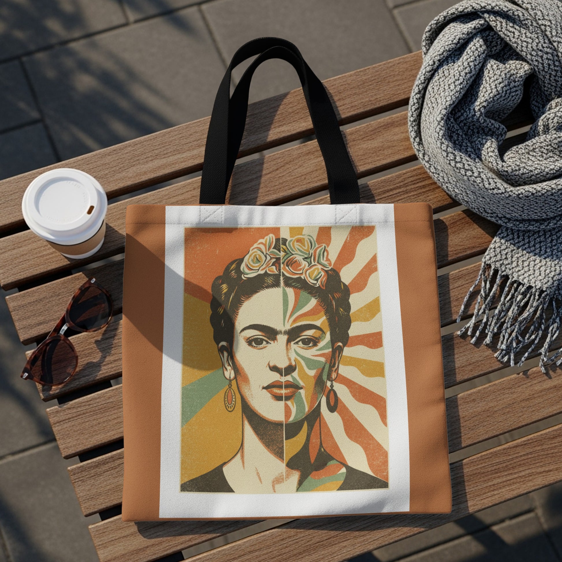 Tote bag with Frida Kahlo portrait and colorful sunburst background.