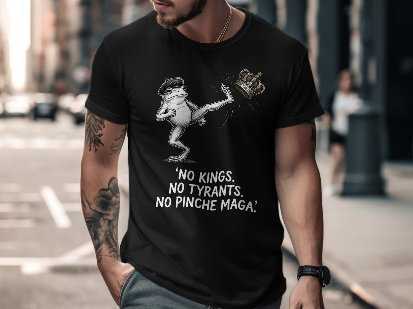 Black t-shirt with frog kicking crown, text "NO KINGS. NO TYRANTS. NO PINCHE MAGA."