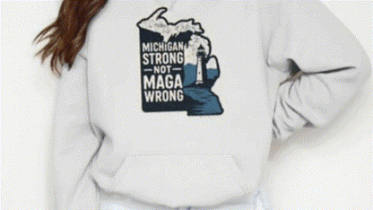 A person wearing a white hoodie with a graphic design on the back.