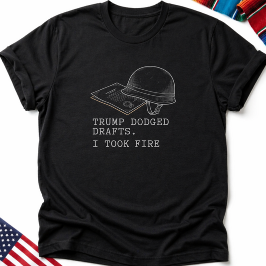 Black t-shirt with text "TRUMP DODGED DRAFTS. I TOOK FIRE" and helmet graphic.