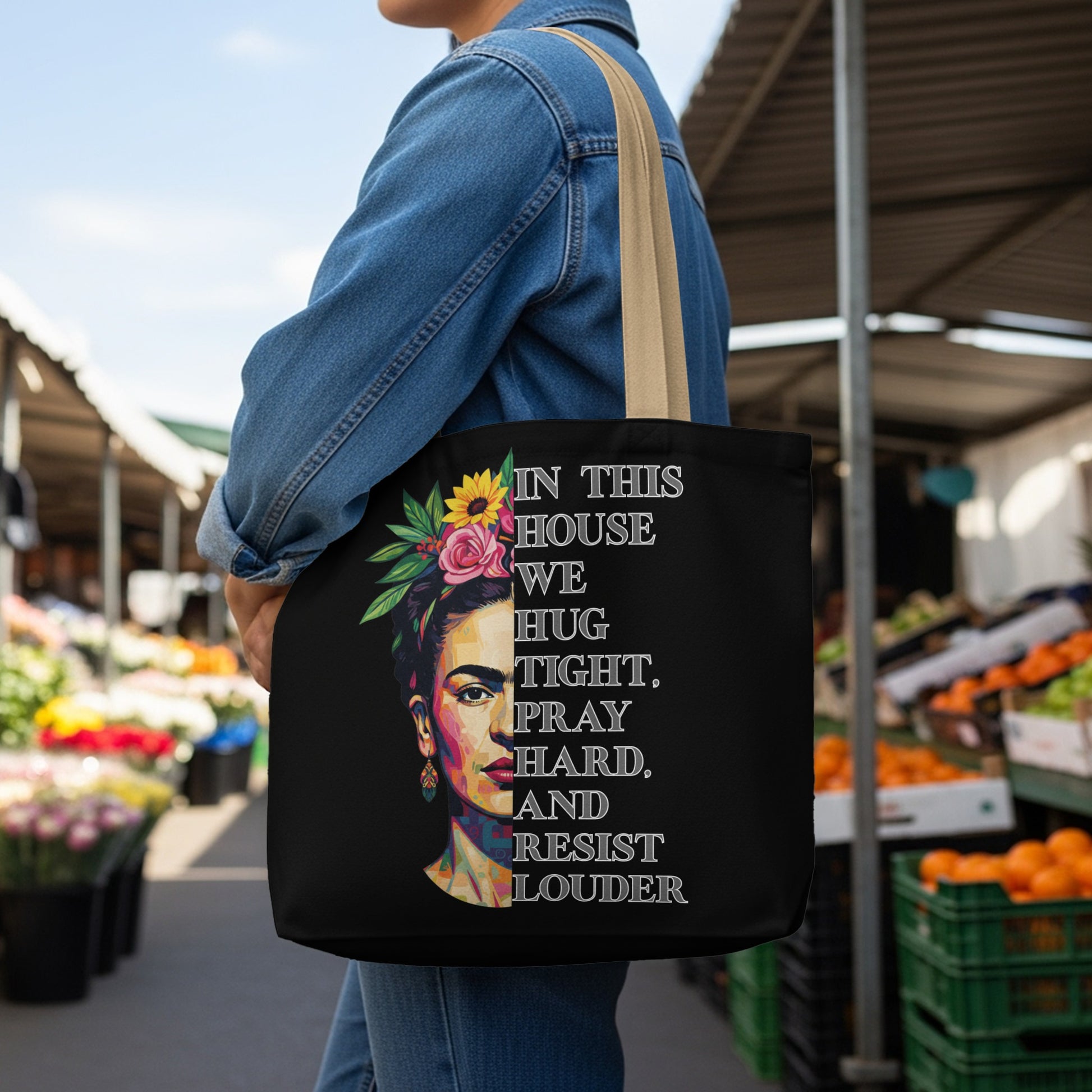 Tote bag with Frida Kahlo portrait and empowering text in English.