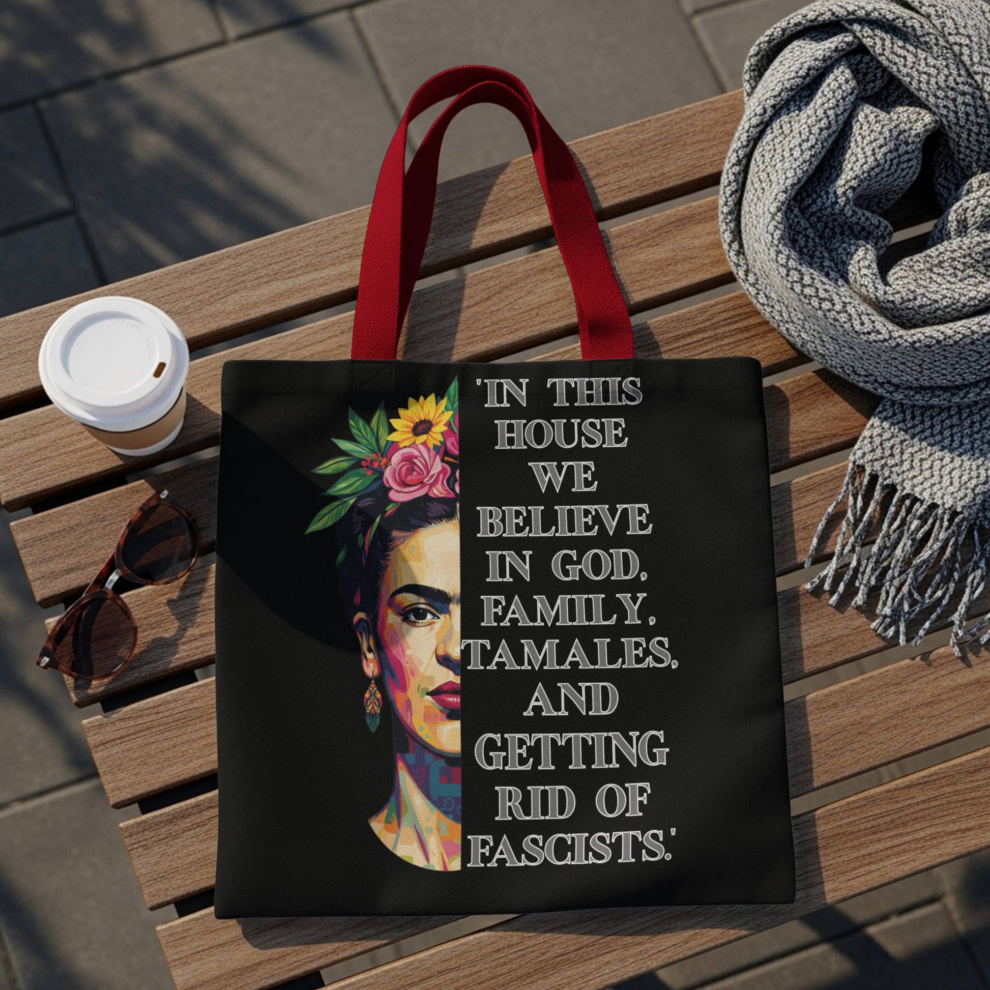 Black tote bag featuring Frida Kahlo portrait and text about faith, family, and tamales.