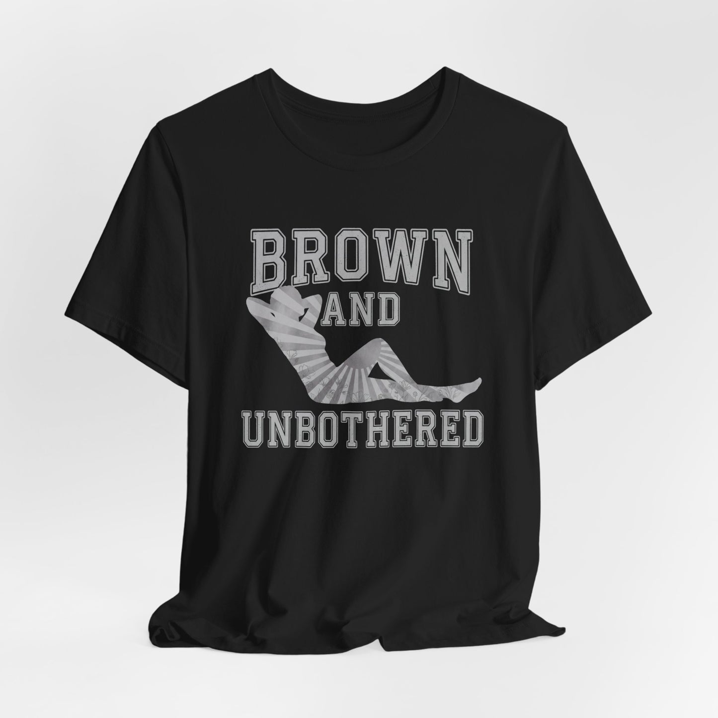 Black t-shirt with "BROWN AND UN<bos> BOTHERED" text and sun ray graphic.