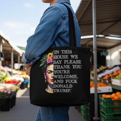 Black tote bag with Frida Kahlo and text about politeness and Donald Trump.