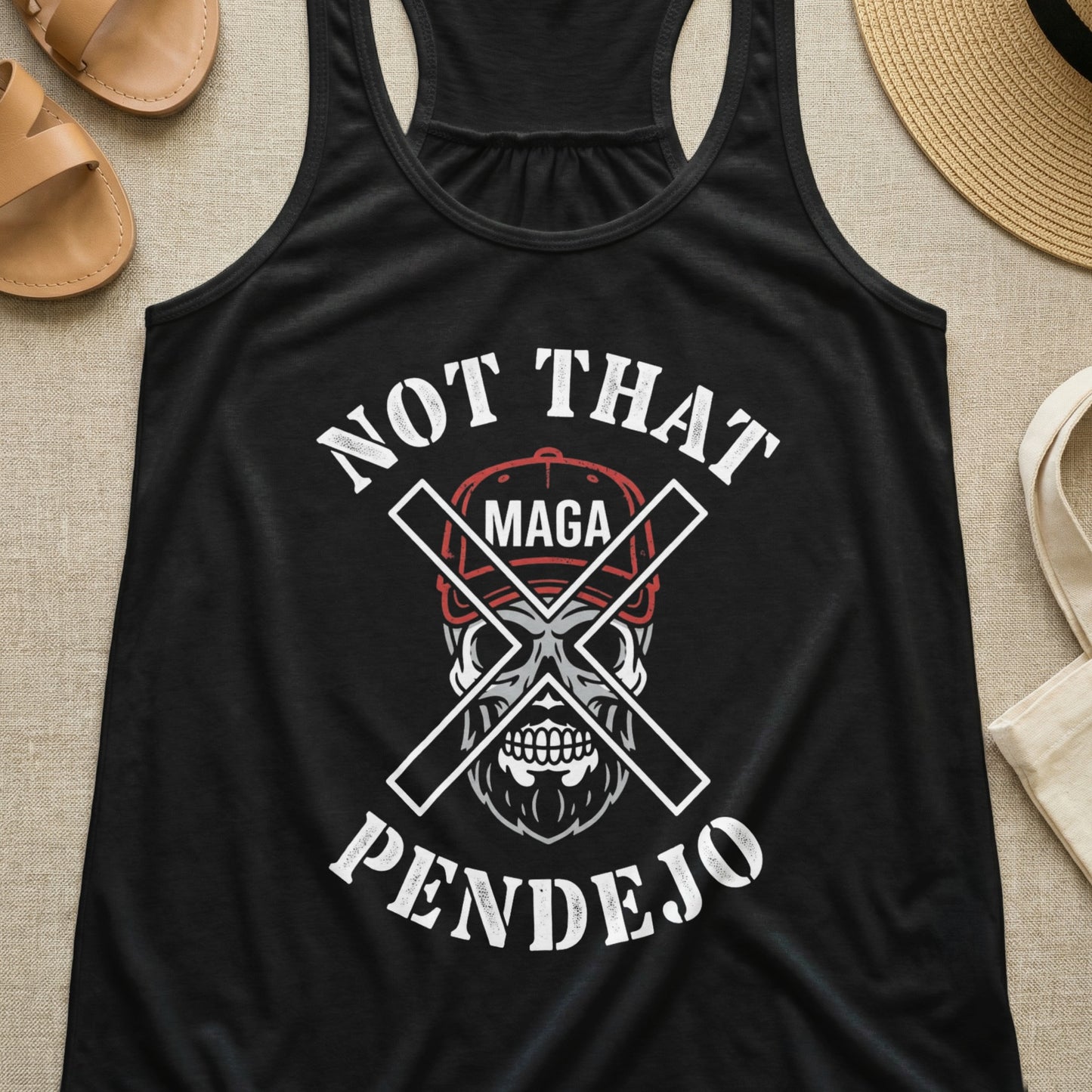Black tank top with skull wearing MAGA hat, crossed swords, and text "NOT THAT PENDEJO".