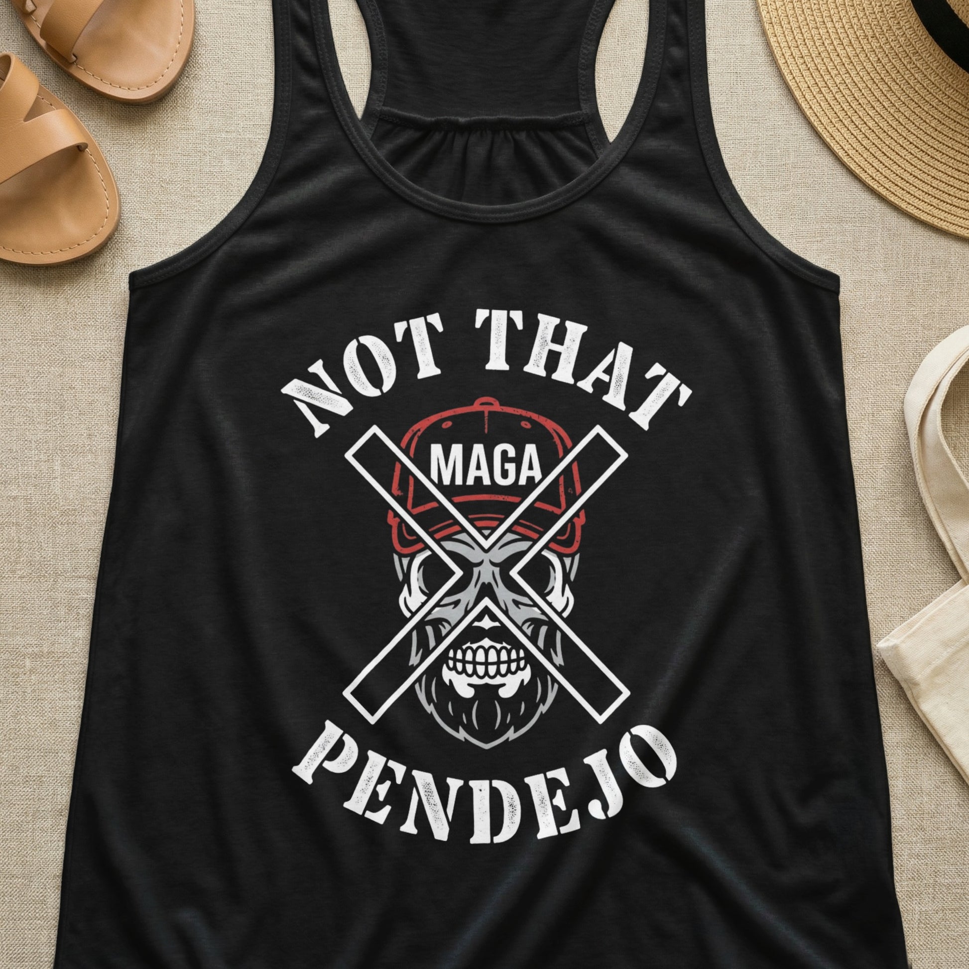 Black tank top with skull wearing MAGA hat, crossed swords, and text "NOT THAT PENDEJO".