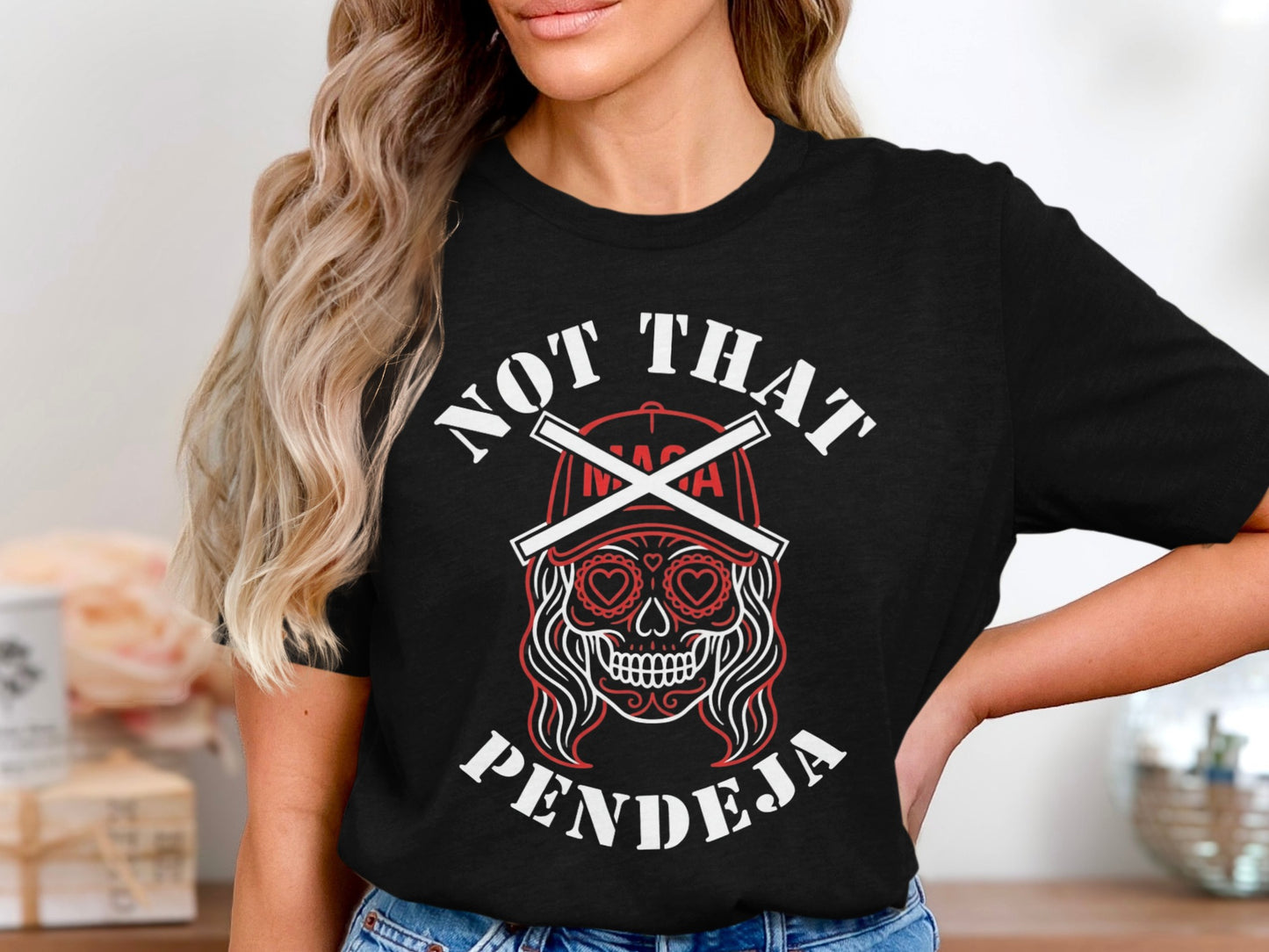Black t-shirt with "NOT THAT PENDEJA" and a skull design.