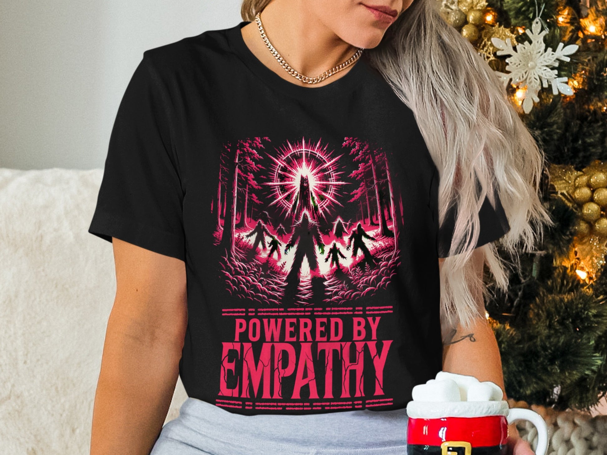 Black t-shirt with "POWERED BY EMPATHY" and shadowy figures in a forest.