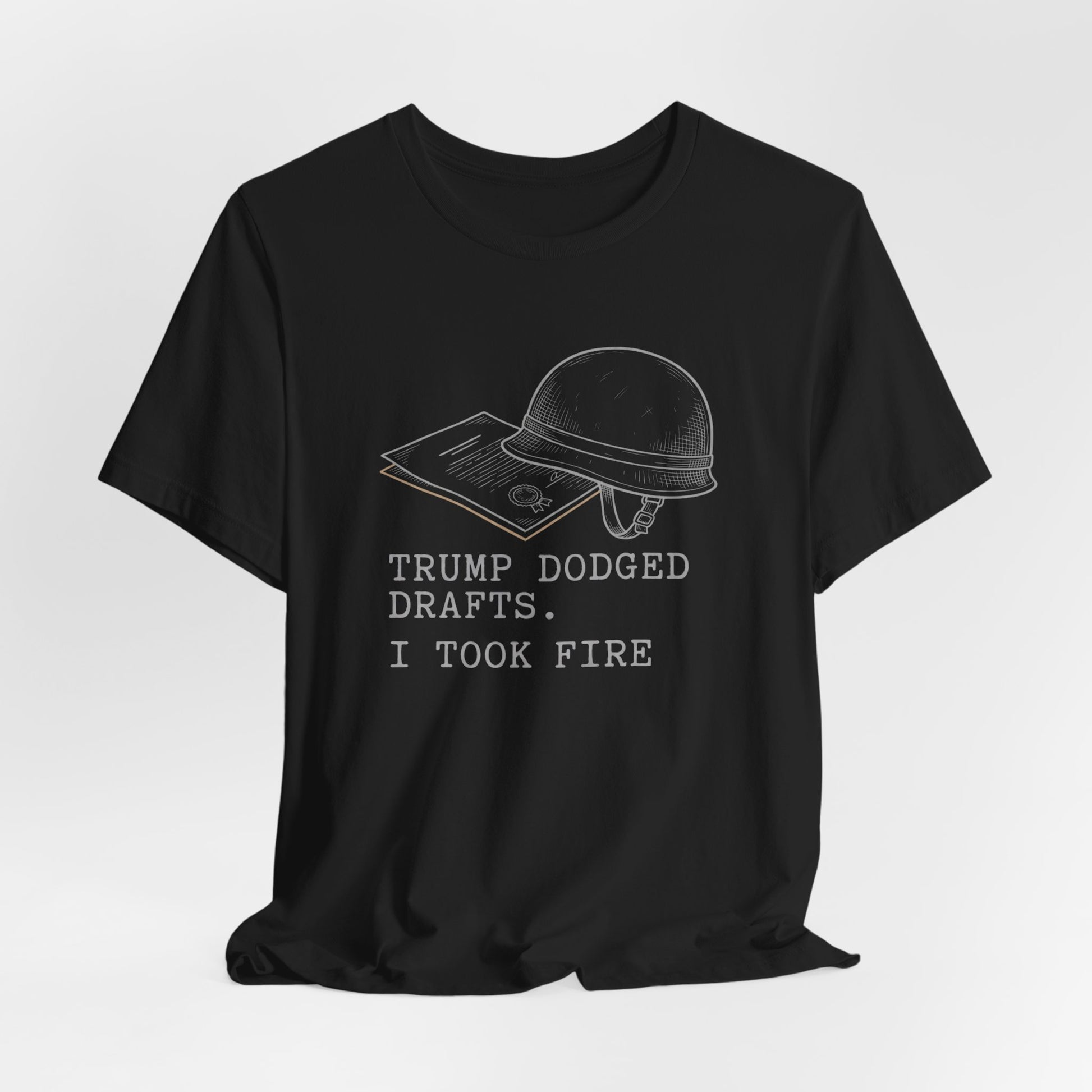 Black t-shirt with "TRUMP DODGED DRAFTS. I TOOK FIRE." text and helmet graphic.