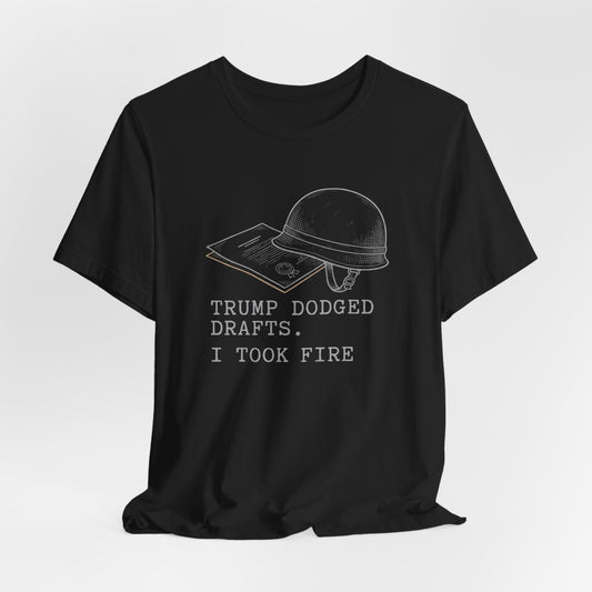 Black t-shirt with "TRUMP DODGED DRAFTS. I TOOK FIRE." text and helmet graphic.