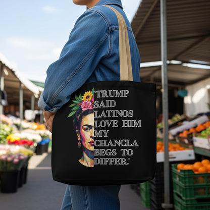 Black tote bag with colorful portrait and text TRUMP SAID LATINOS LOVE HIM MY CHANCLA BEGS TO DIFFER.