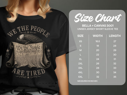 Black t-shirt with "We the People Are Tired" text and an eagle on parchment.
