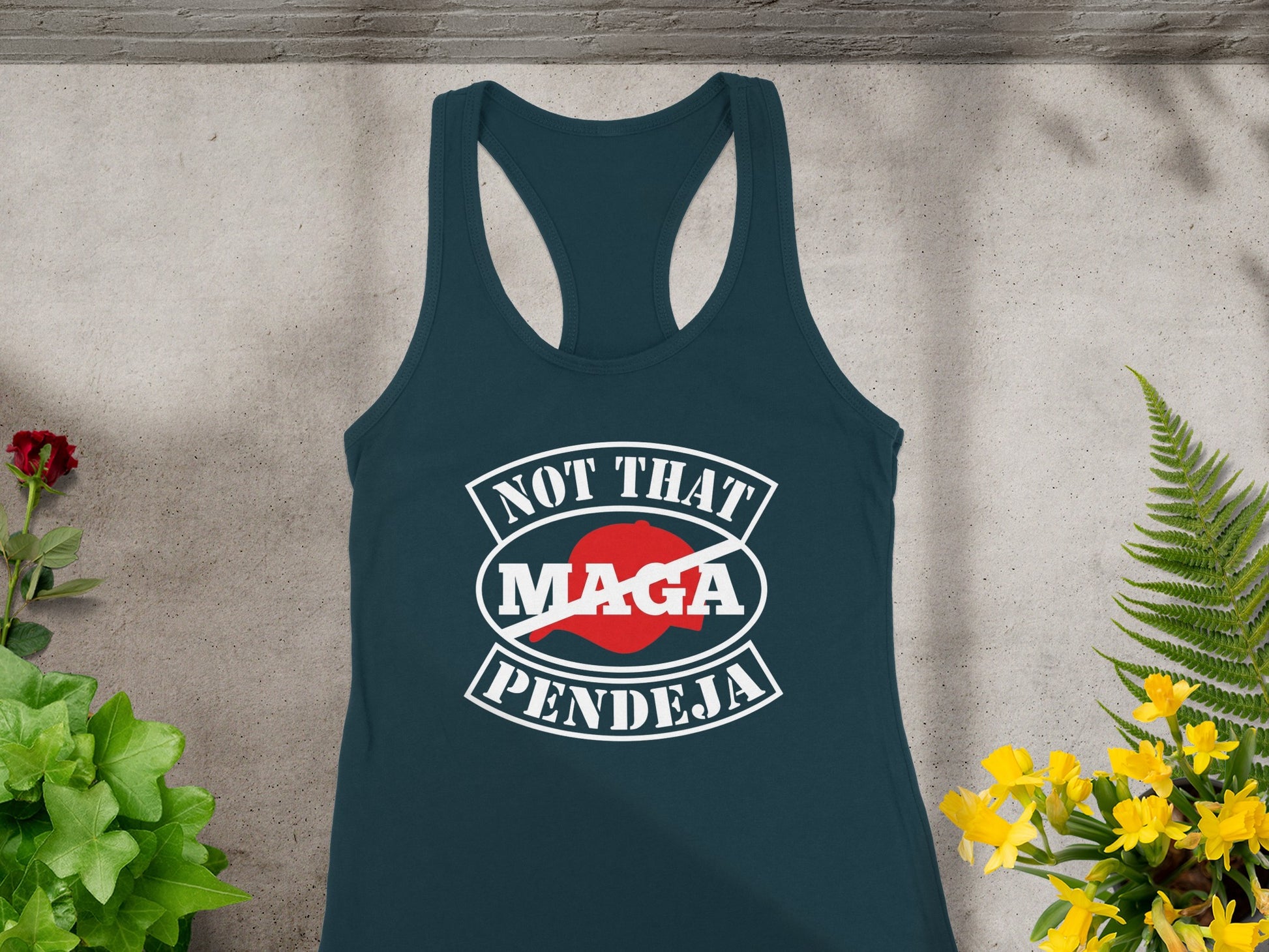 Dark teal tank top with "NOT THAT MAGA PENDEJA" graphic.