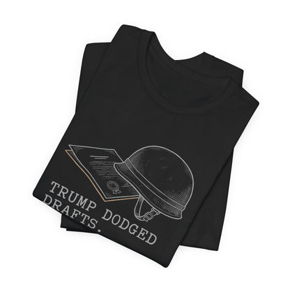 Black t-shirt with white text "TRUMP DODGED DRAFTS." and drawing of a helmet.