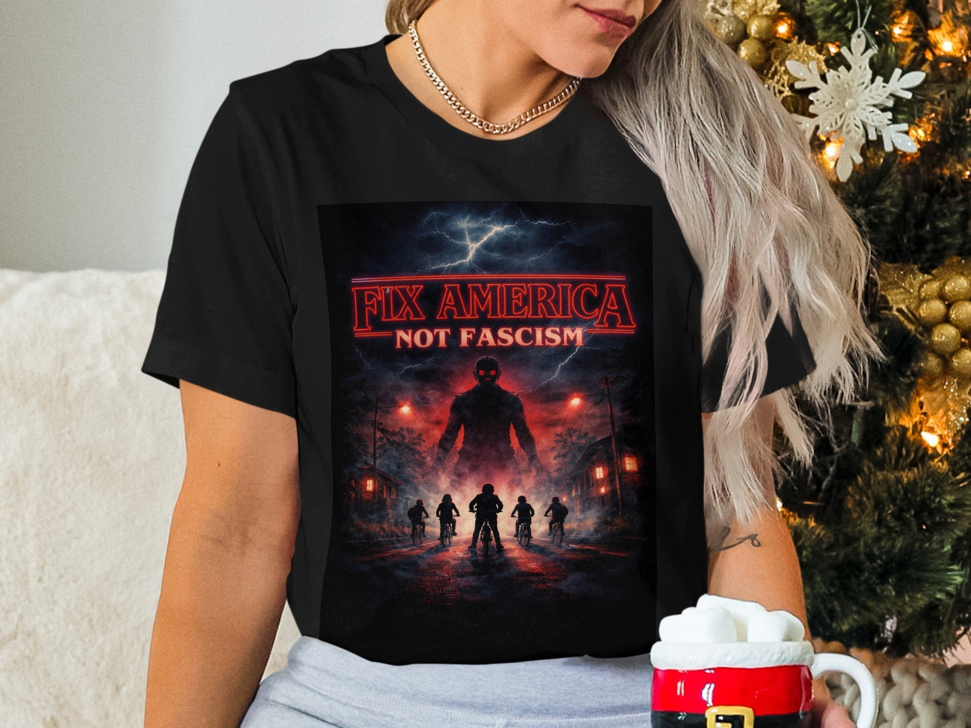 Black t-shirt with "Fix America Not Fascism" slogan and ominous figure.
