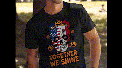 A person wearing a black t-shirt with a skull design and the text "TOGETHER WE SHINE" printed on it.
