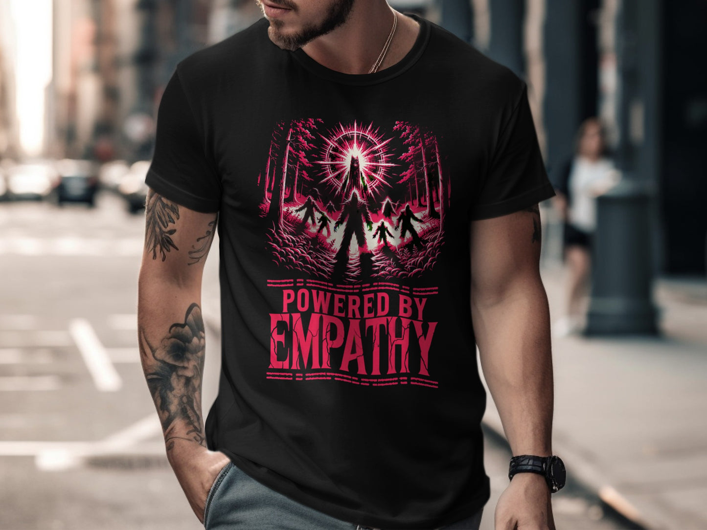 Black t-shirt with "POWERED BY EMPATHY" text and a forest silhouette graphic.