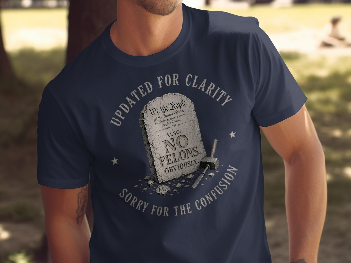 Navy t-shirt with "UPDATED FOR CLARITY" and "NO FELONS OBVIOUSLY" text.