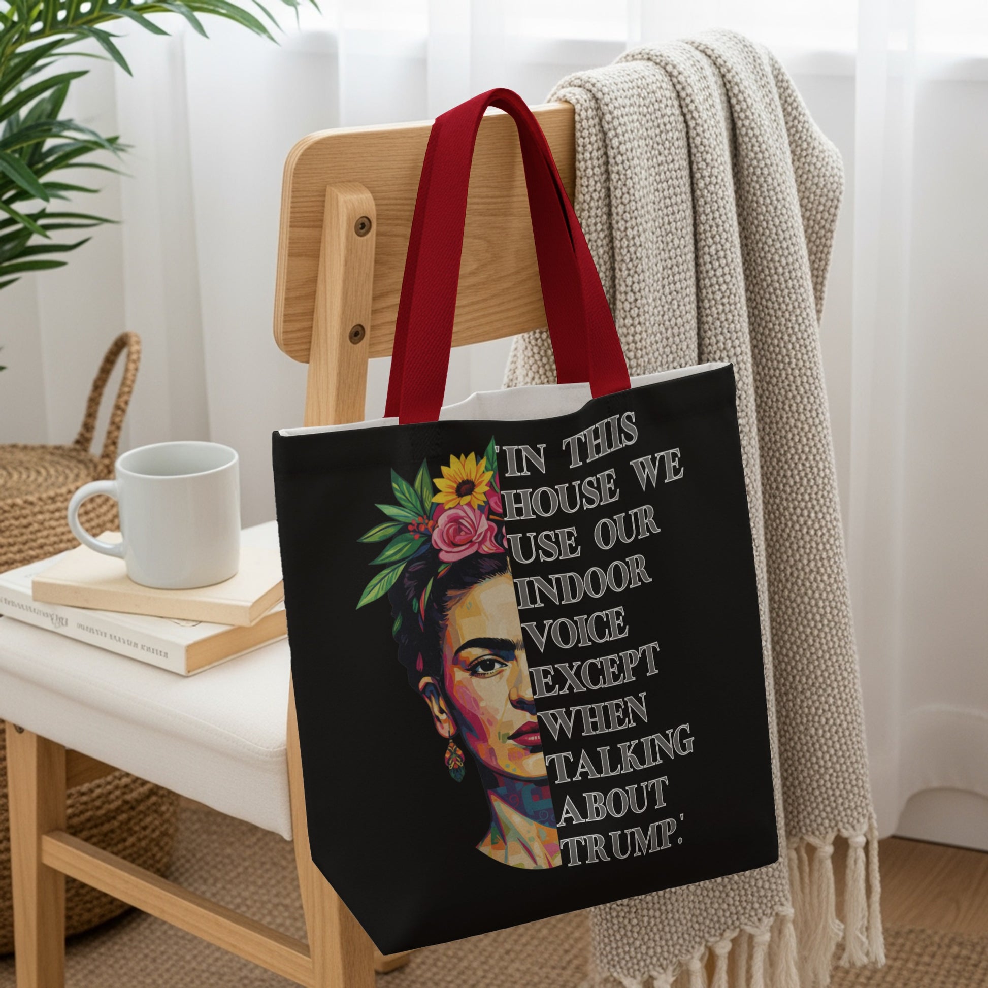 Tote bag with Frida Kahlo portrait and text: "In this house we use our indoor voice except when talking about Trump."
