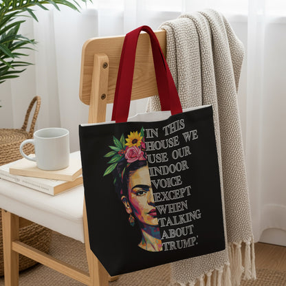 Tote bag with Frida Kahlo portrait and text: "In this house we use our indoor voice except when talking about Trump."