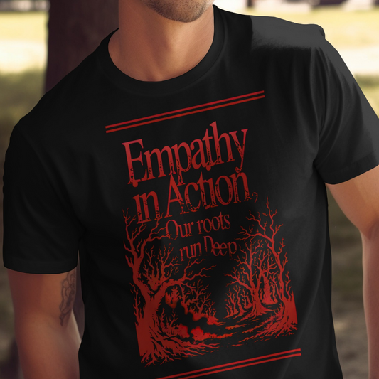 Black t-shirt with red text "Empathy In Action Our roots run Deep" and tree graphics.