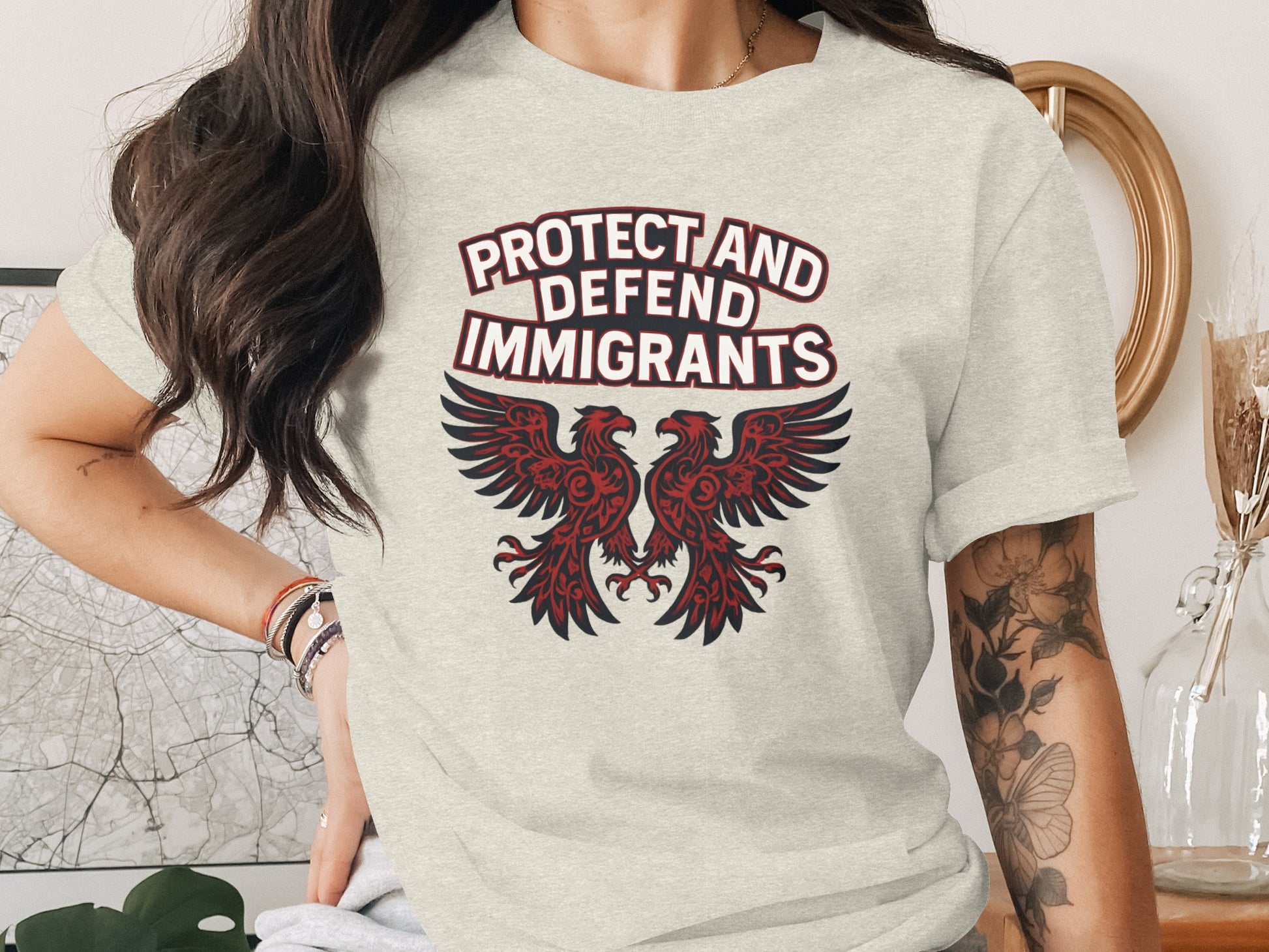 Protect and Defend Immigrants Graphic Tee product