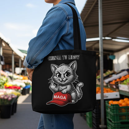 Black tote bag with a cartoon cat giving the middle finger over a MAGA hat.