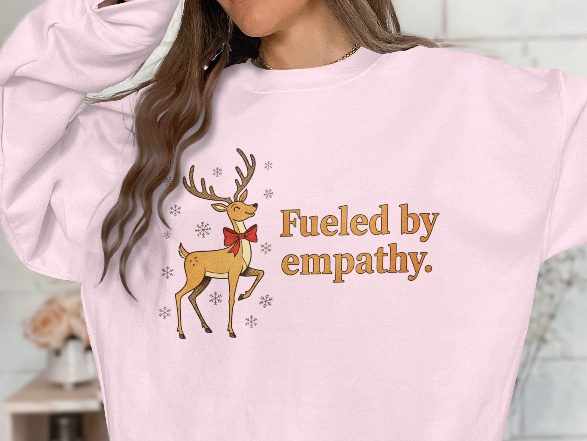 Fueled by empathy with reindeer graphic sweater