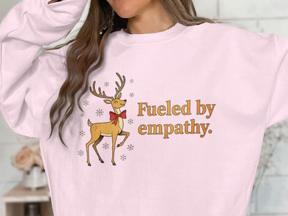 Fueled by empathy with reindeer graphic sweater