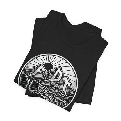 Black t-shirt with white mountain and sun graphic, text "FAITH DEMOCRACY TRUTH".