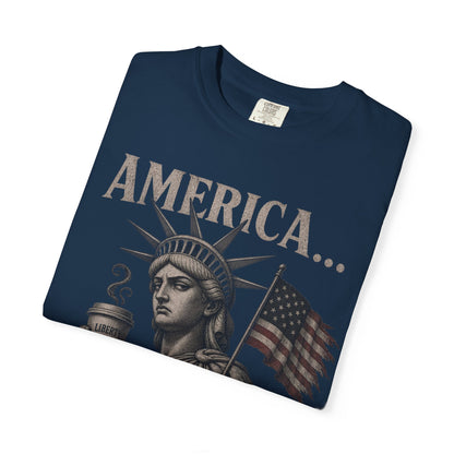 Statue of Liberty and American flag graphic on navy t-shirt.