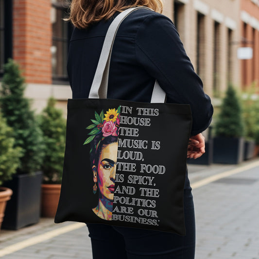 Black tote bag with Frida Kahlo graphic and quote about loud music, spicy food, and politics.