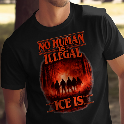 Black t-shirt with "No Human is Illegal" and a forest scene.